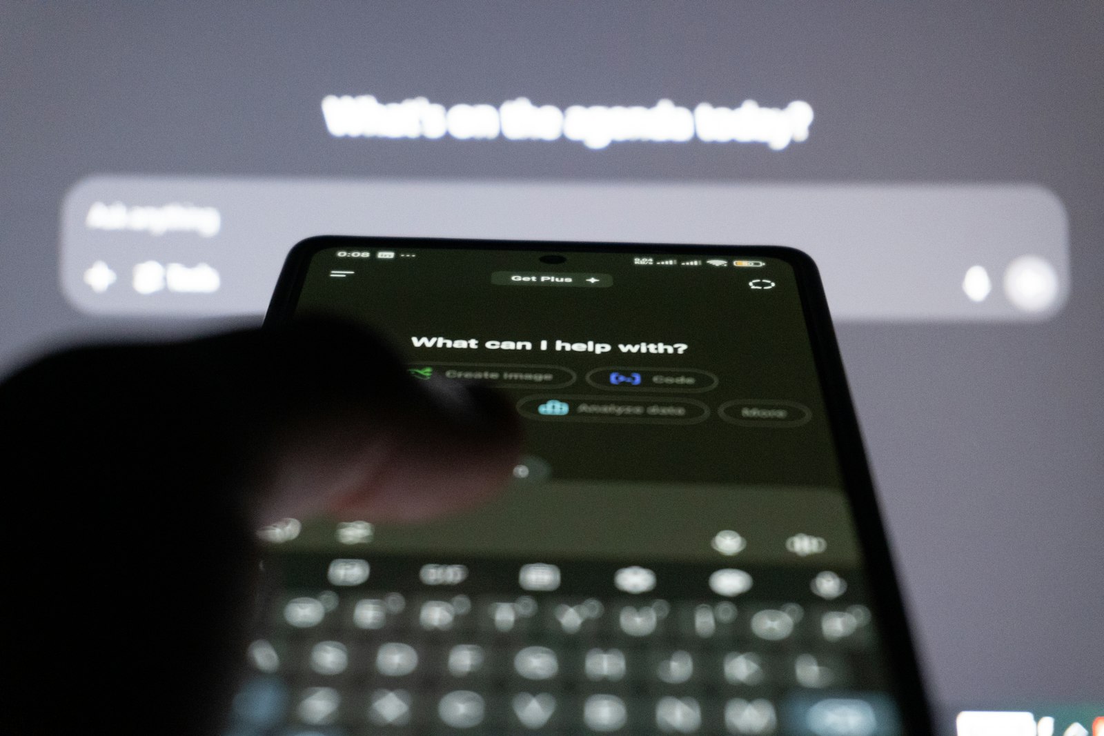 A person typing on a smartphone with an AI chatbot on screen